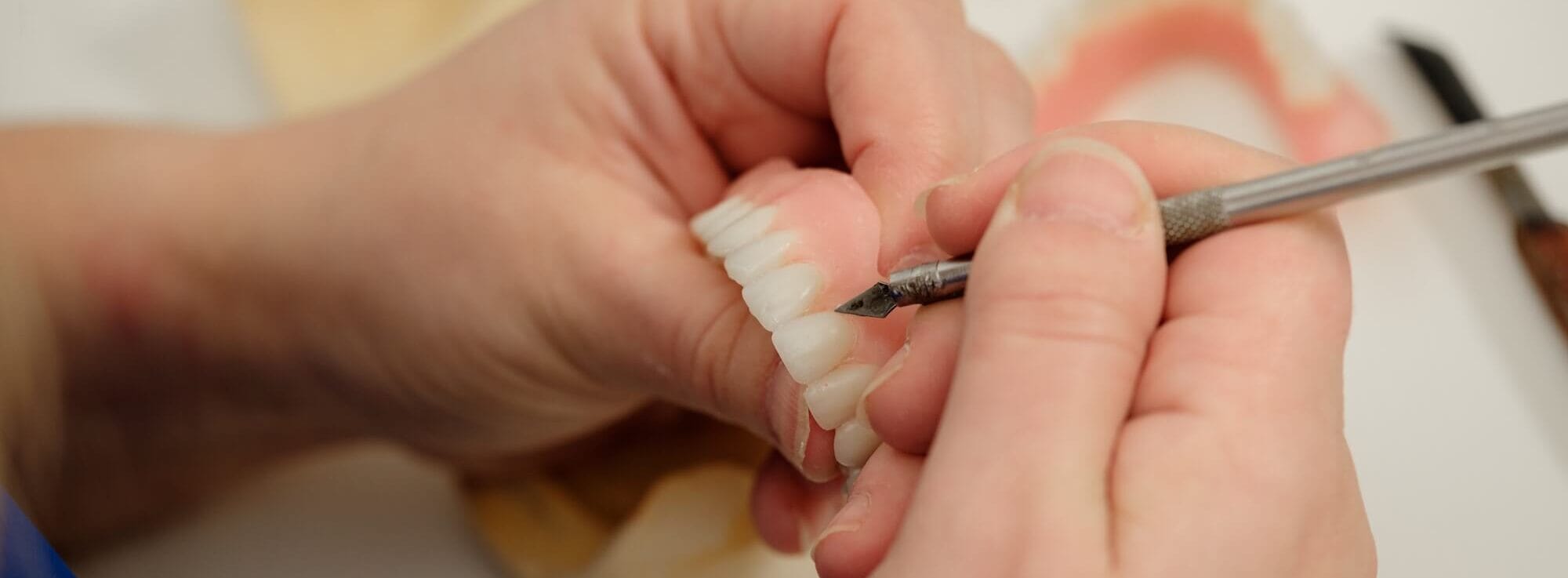 Close up of dentures being worked on